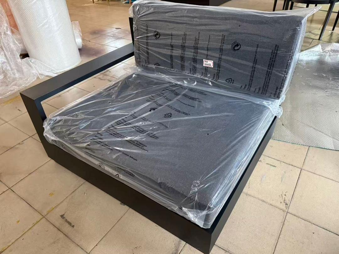 Custom black outdoor bed frame with cushion