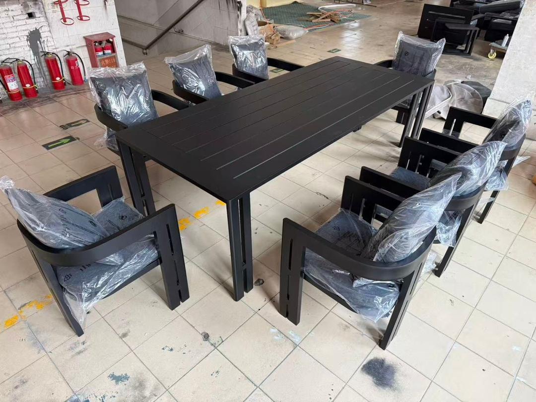 Custom black outdoor dining table with 8 chairs